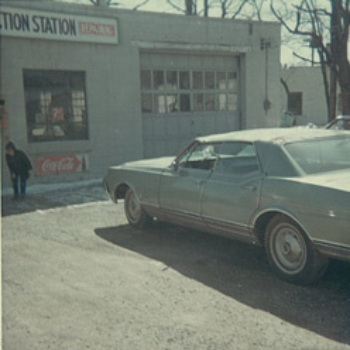 classic car outside auto garage