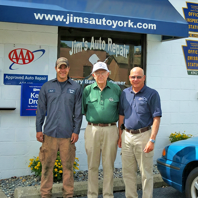 Auto repair staff standing outside