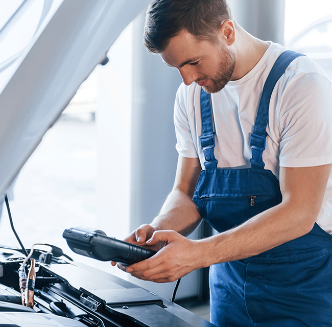 Mechanic performing car diagnostics