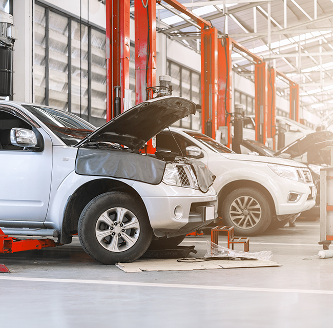 Car on lift being serviced