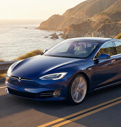 Blue electric sedan on highway