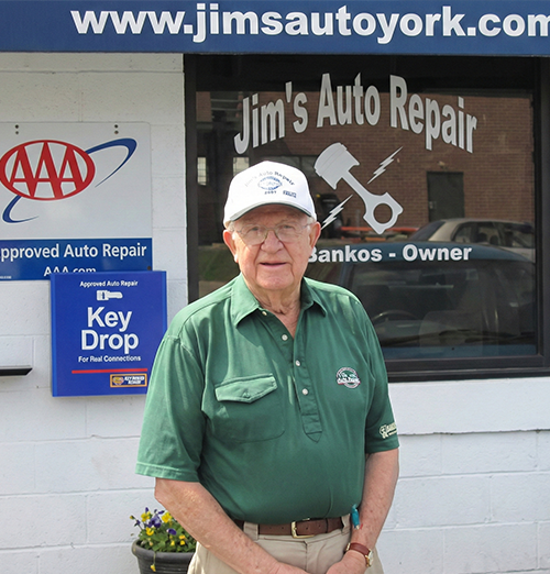 Man outside auto repair shop